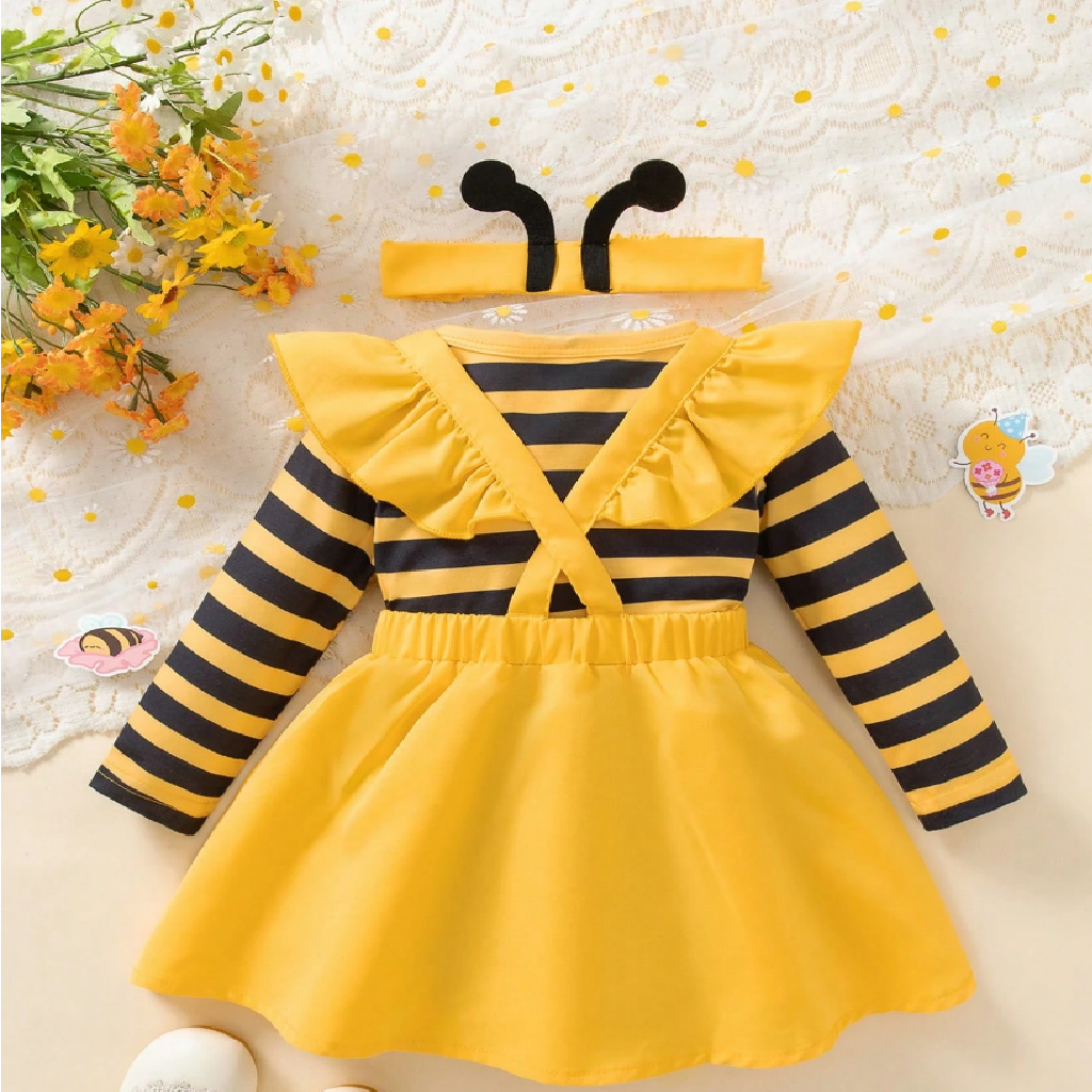 Yellow and black striped dress with a headband on a floral background