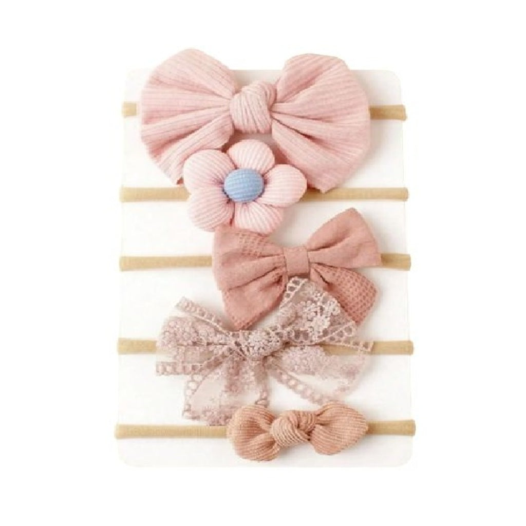 Set of pink hair bows with flowers on wooden sticks