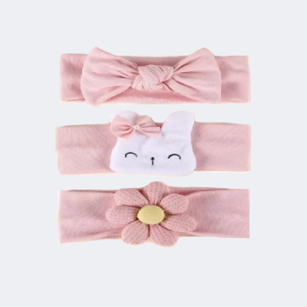 Set of three pink baby headbands with different designs on a white background