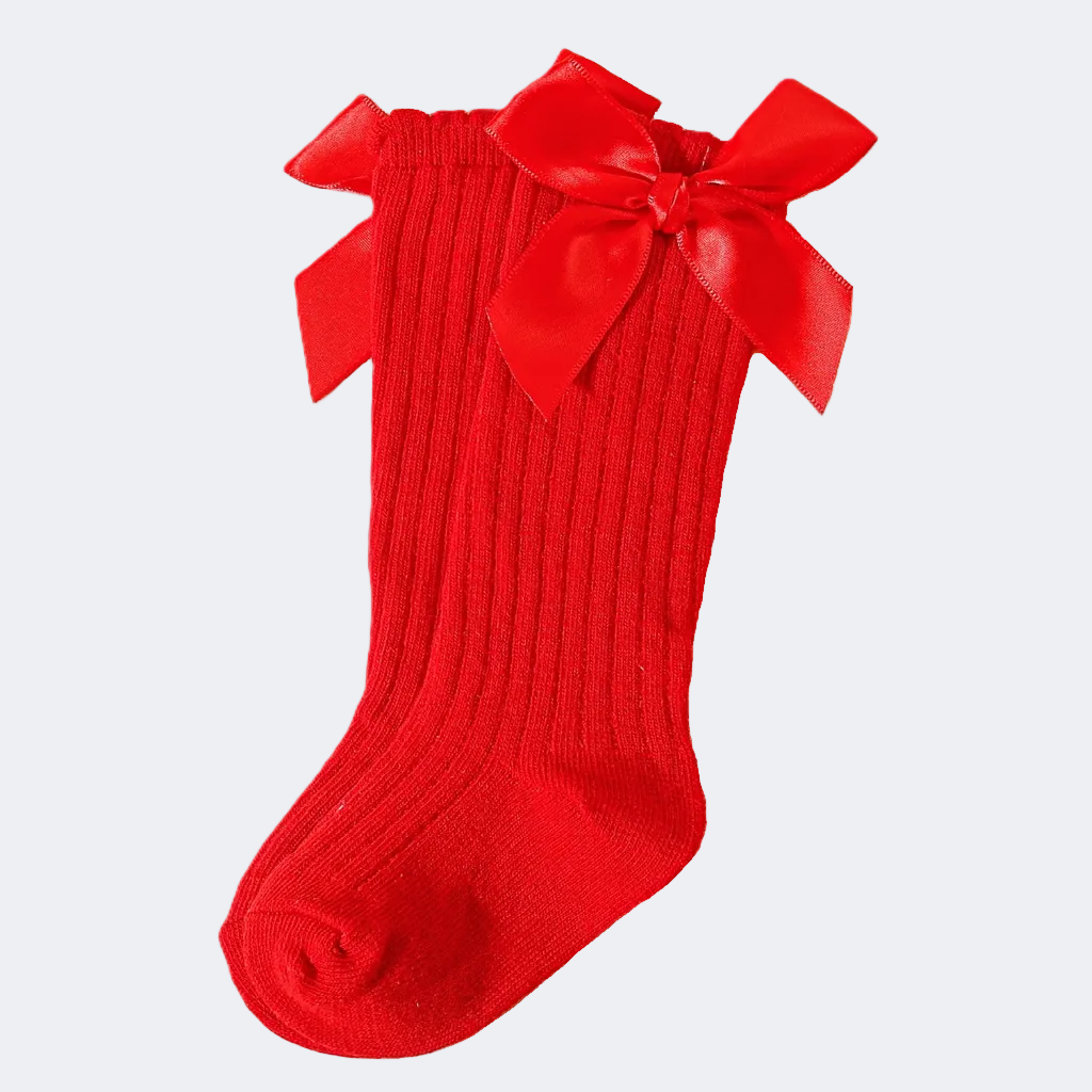 Red sock with a large bow on a white background