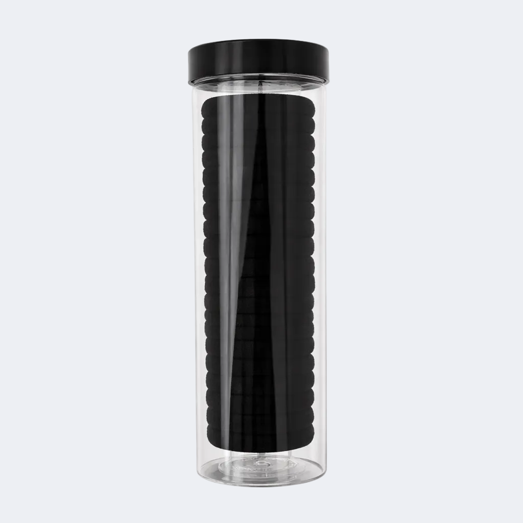 Clear tumbler with black lid and textured black interior on a white background