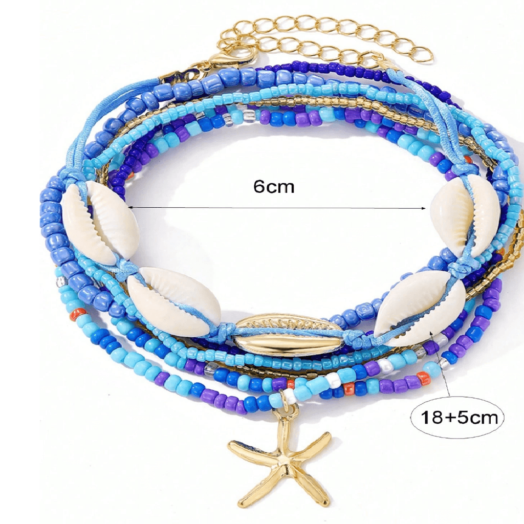 A multi-strand beaded bracelet with blue and purple beads, white cowrie shells, a gold starfish charm, and a gold chain extender. The image includes dimension callouts showing a 6cm width and a total length of 18+5cm.