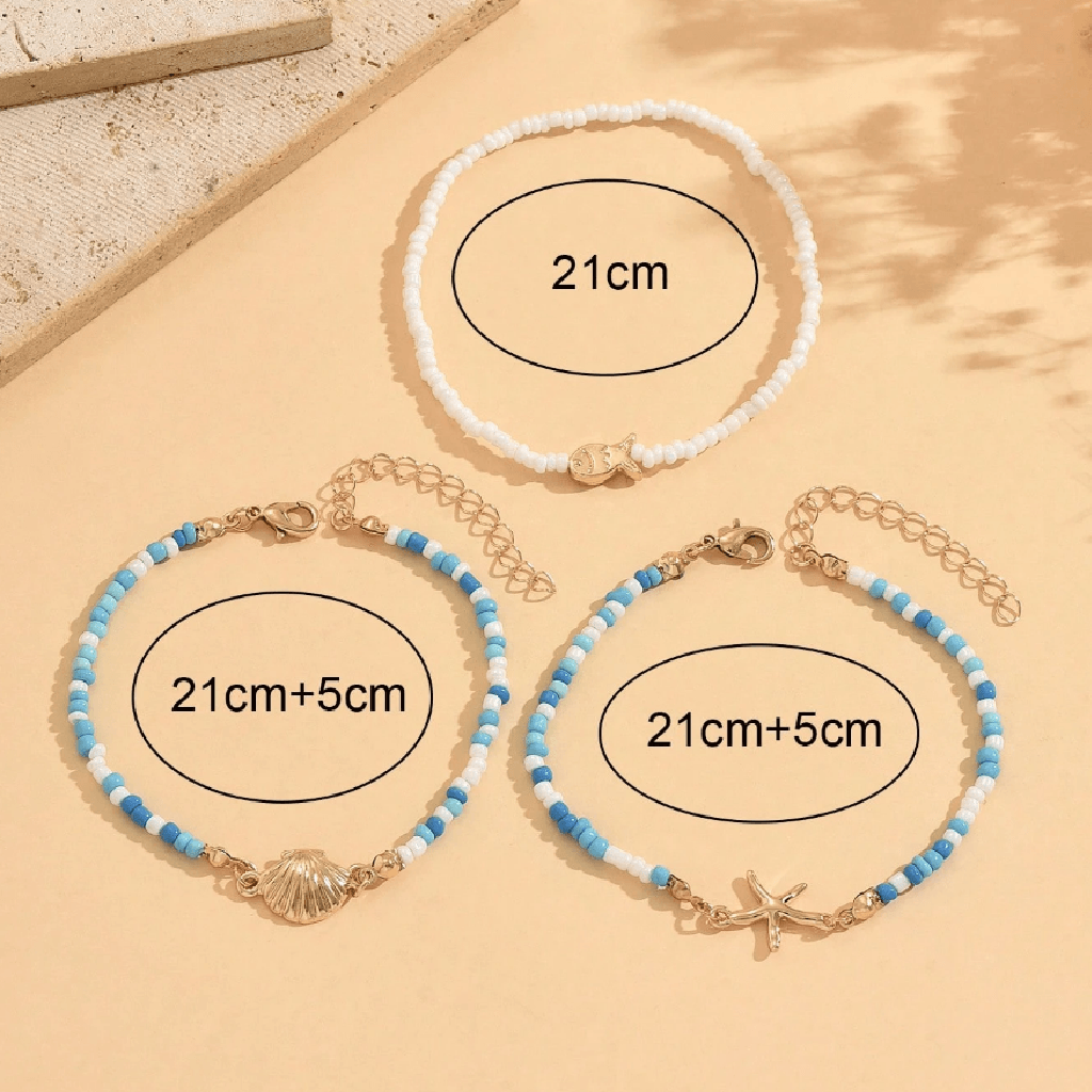 Three beaded bracelets with shell and starfish charms on a beige surface, showing measurements.