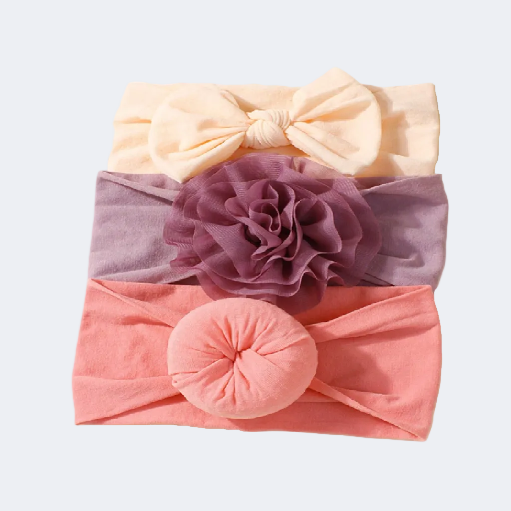 Set of three headbands with a bow, flower, and round design