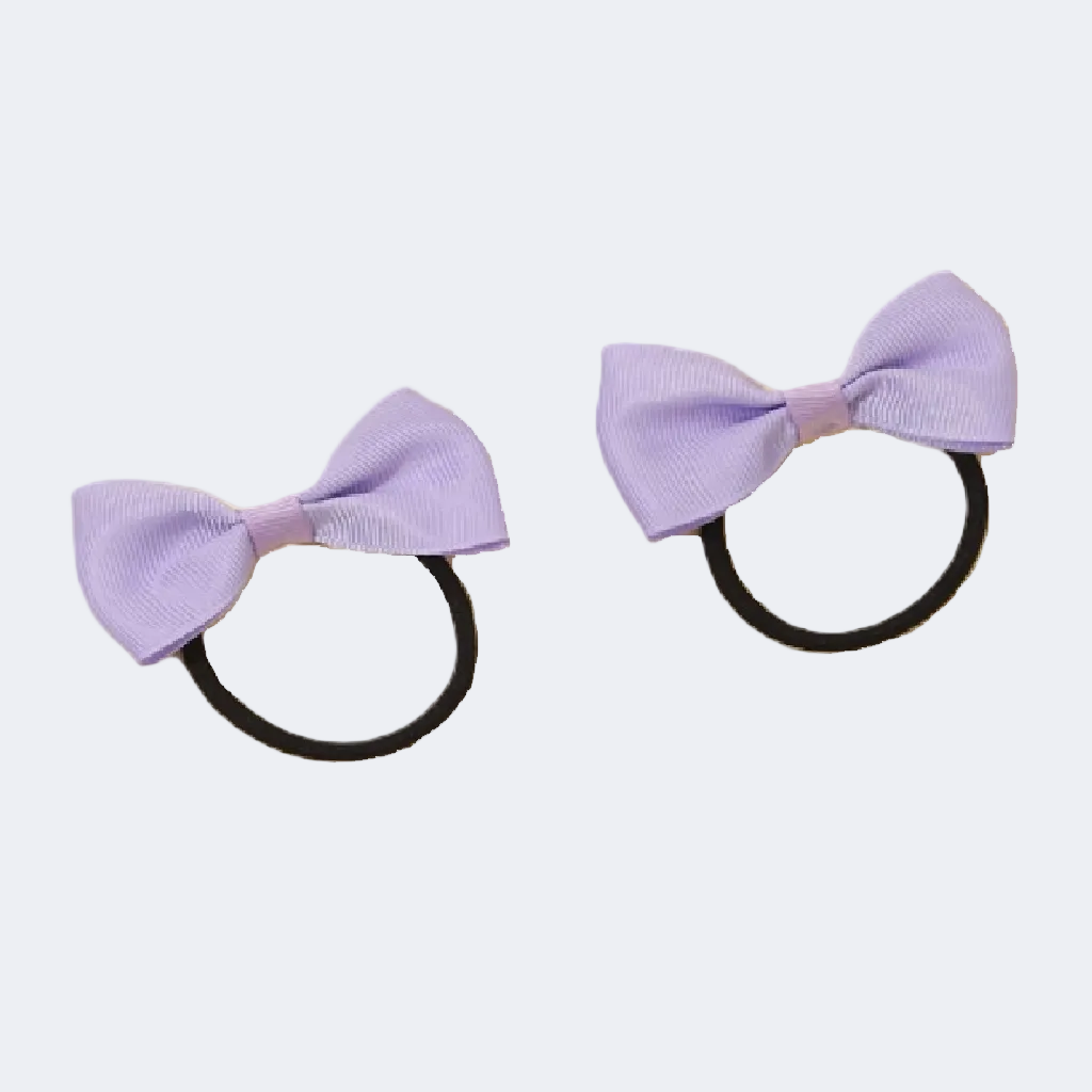 Two purple hair bows on black elastics against a white background