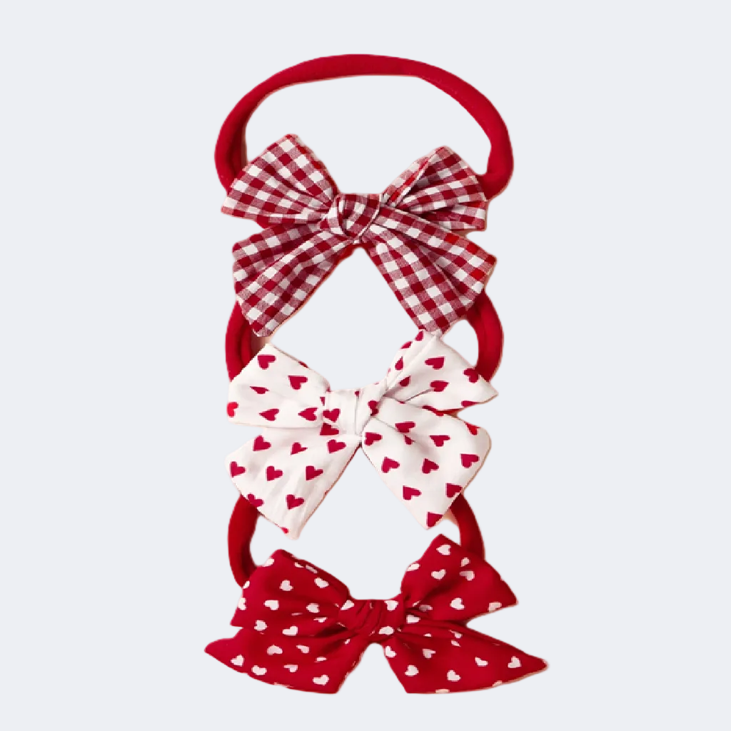 Set of three red and white hair bows