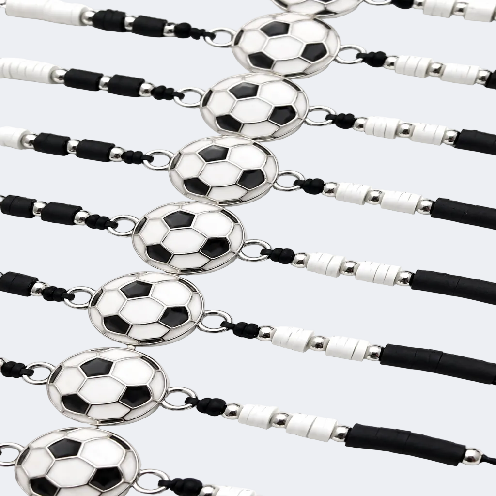 Multiple necklaces with soccer ball pendants on a white background