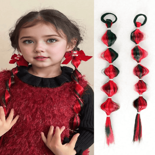 Child with red and black hair extensions and two extensions displayed on a beige background