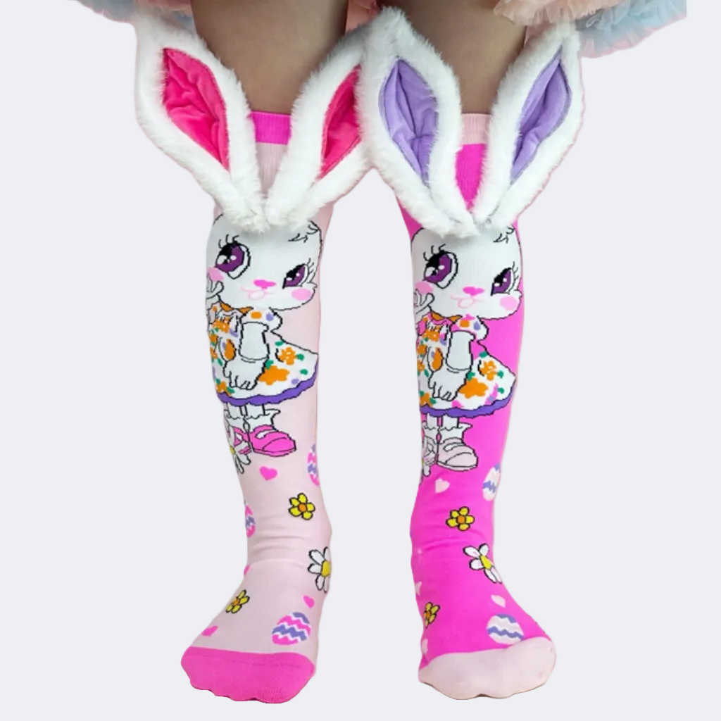 Pink knee-high socks with cartoon character design and bunny ears on a white background