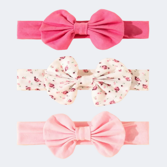 Three pink headbands with large bows