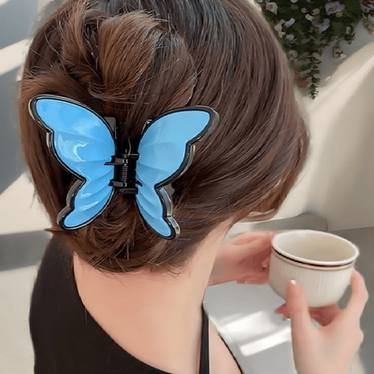 Person with a blue butterfly hair clip
