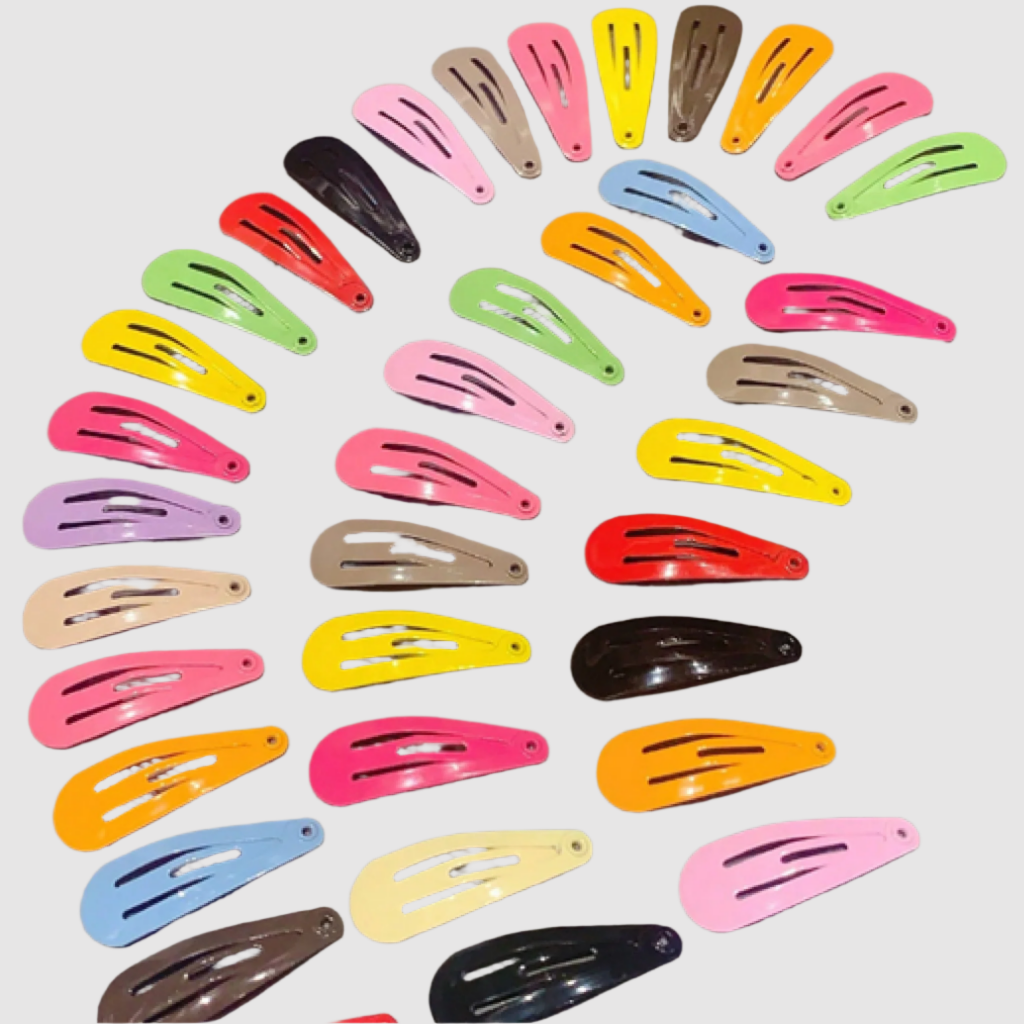 A collection of colorful hair clips in various shades arranged neatly on a surface.