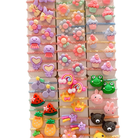A collection of twisted hair ties in assorted colors with various cute designs such as animals and fruits.