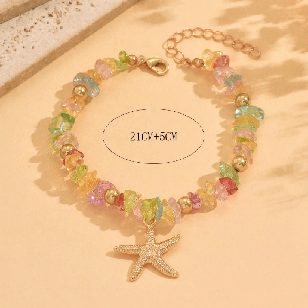 Colorful beaded bracelet with a starfish charm on a beige background