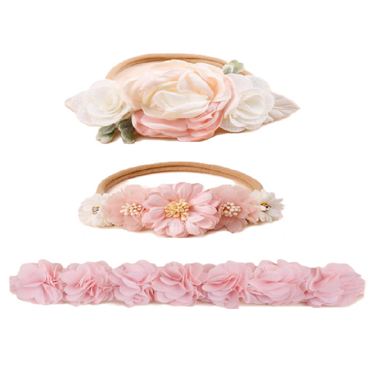 Set of three floral headbands with pink and white flowers on a white background