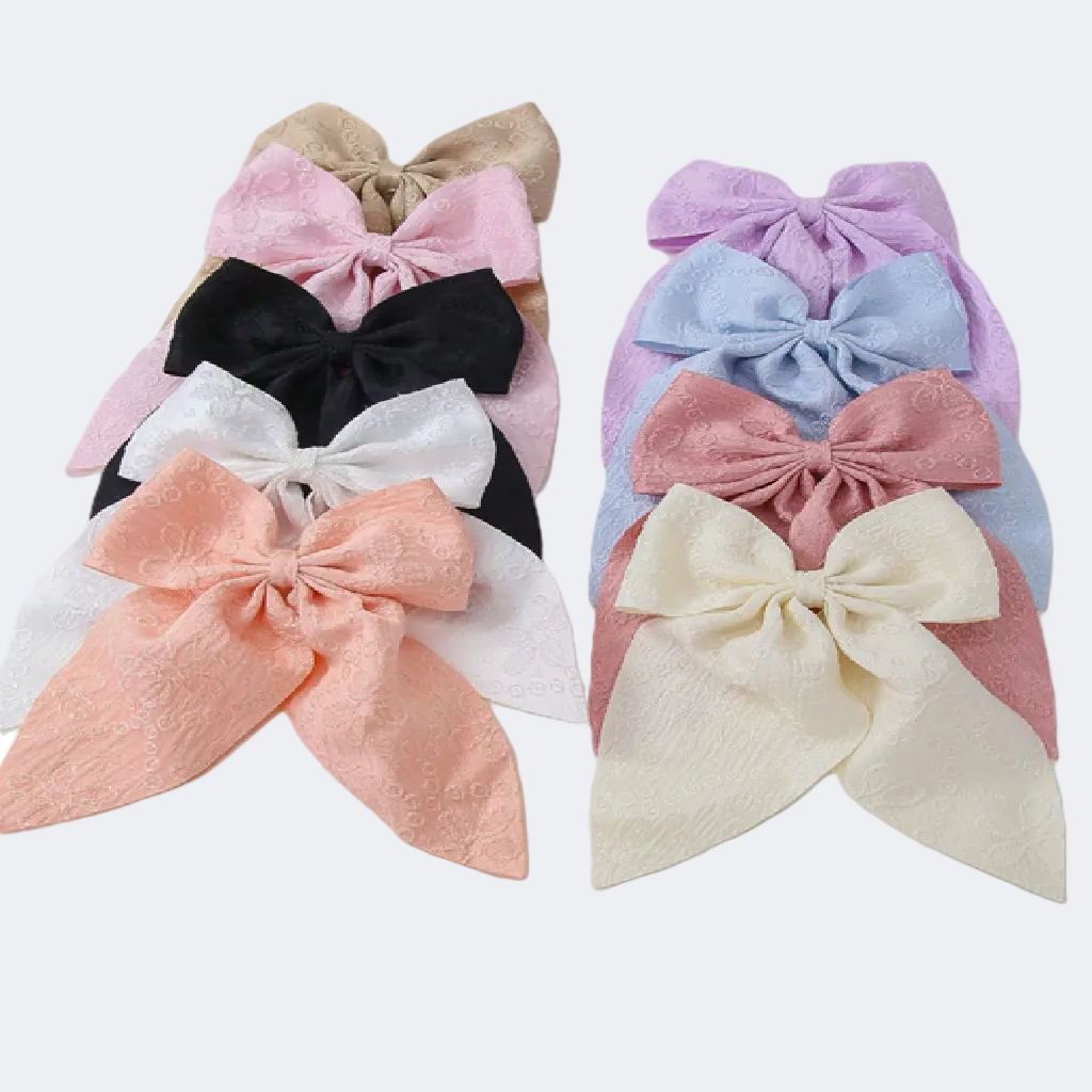 Set of colorful hair bows on a white background