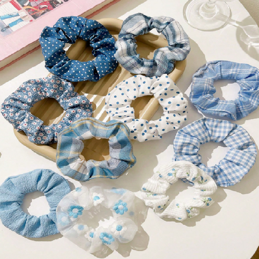 Collection of blue and white scrunchies on a light surface