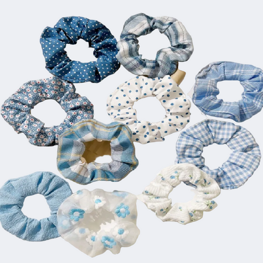 Collection of blue and white scrunchies on a light surface