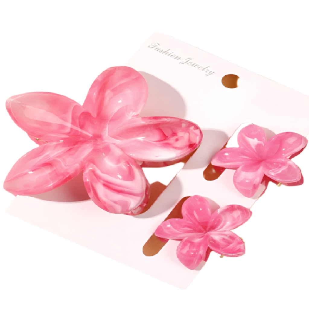 Set of pink flower-shaped hair clips on a white background