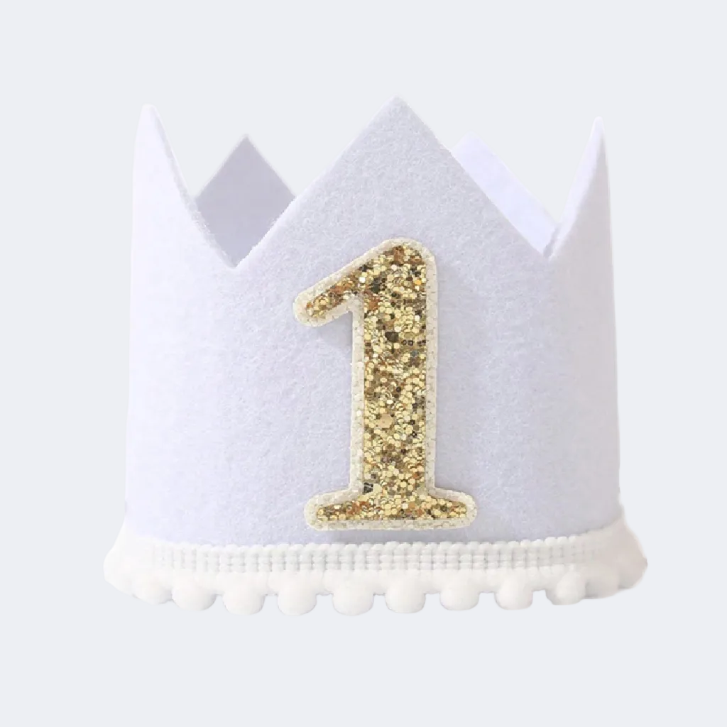 White birthday crown with gold number '1' on a white background