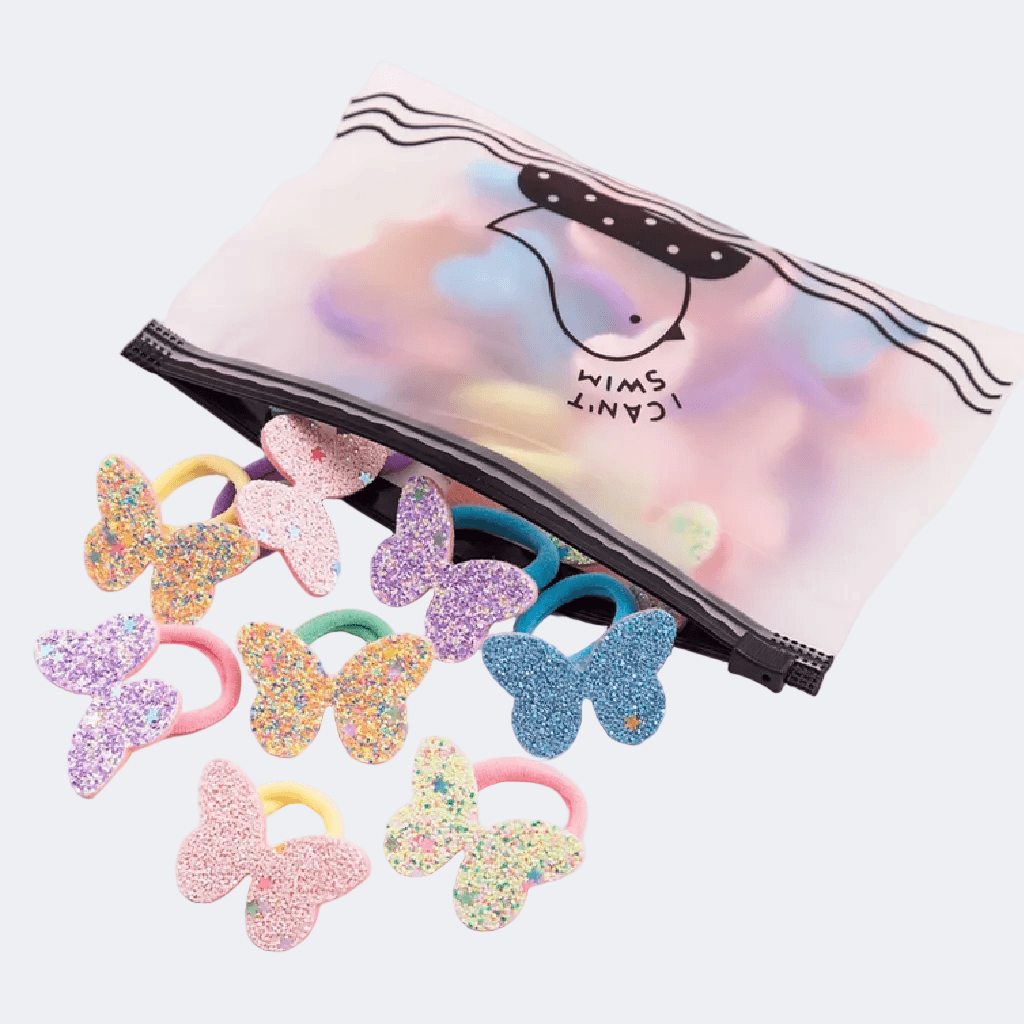 Colorful butterfly-shaped hair ties with a clear pouch on a light gray background