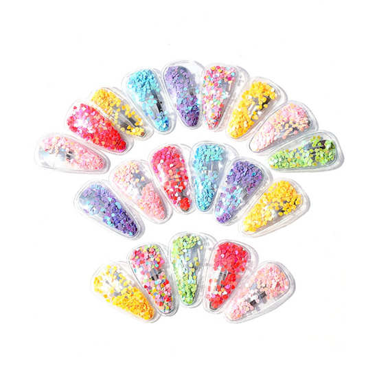Colorful nail art decorations in clear containers arranged in a circular pattern