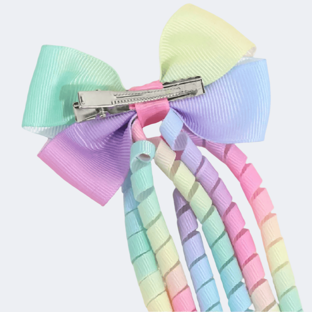 Pastel-colored bow hair clip on a white background