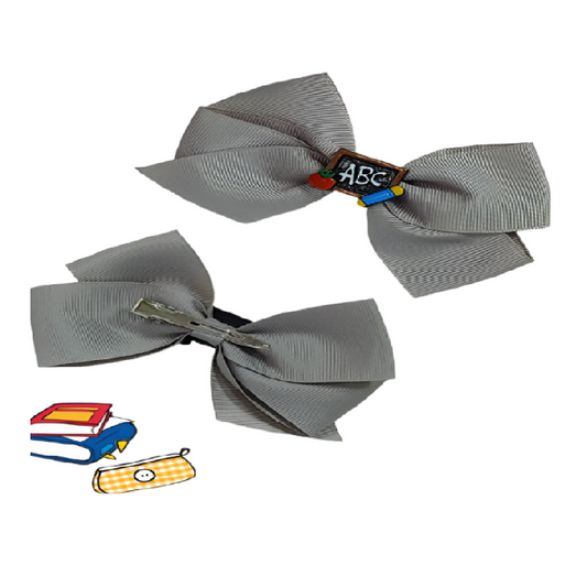 Two gray hair bows with educational-themed clip on a white background