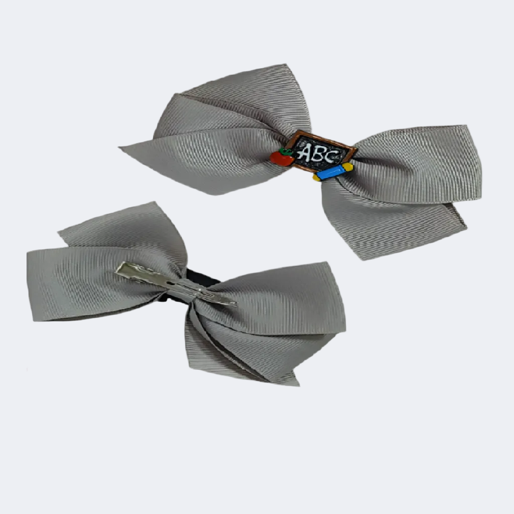 Two gray hair bows with educational-themed clip on a white background