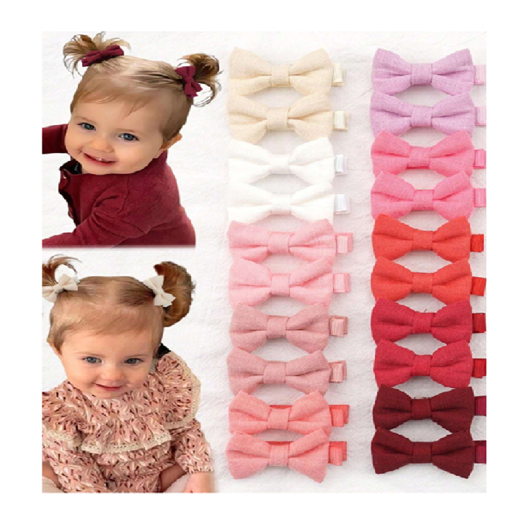 Set of colorful hair bows with two children wearing them