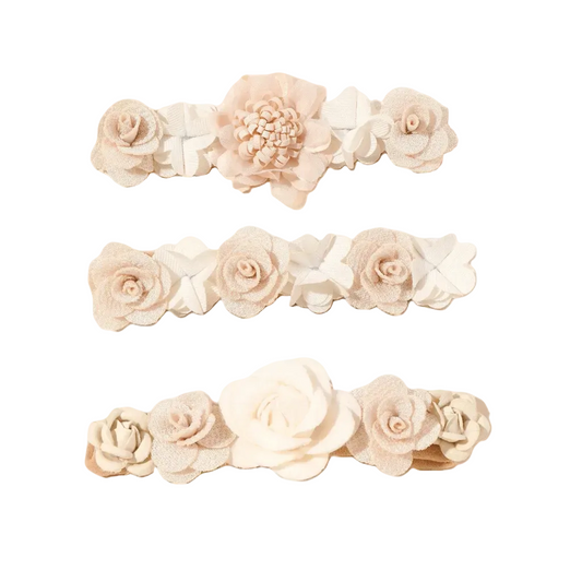Set of three floral headbands with beige and white flowers on a white background