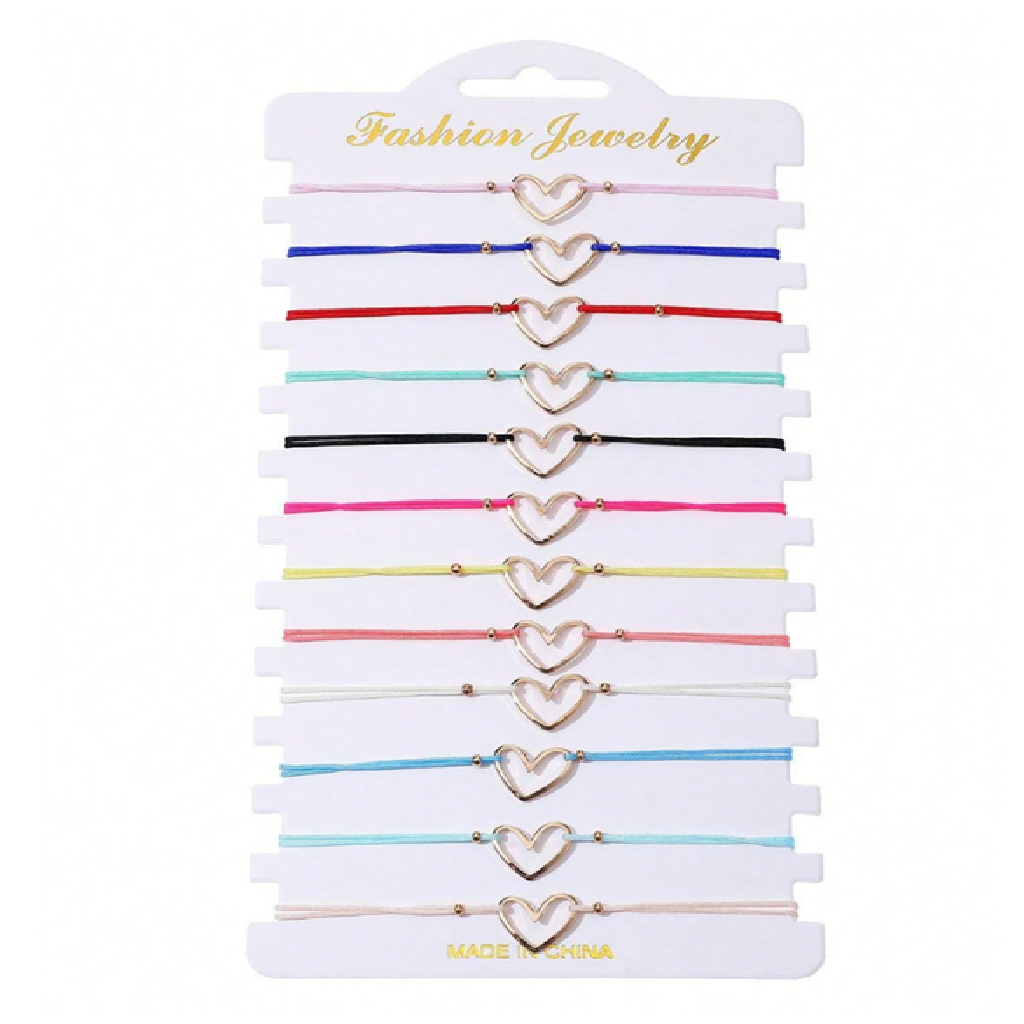 Set of heart-shaped gold bracelets on a white card