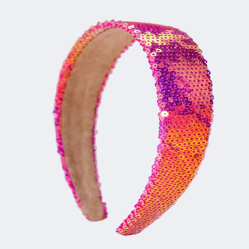 Sequined headband with pink and orange gradient on a beige background