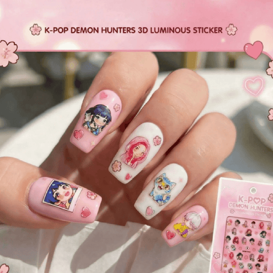 Nails with K-POP DEMON HUNTERS 3D luminous sticker design held by a hand.