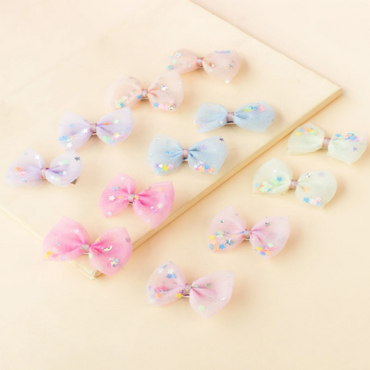 Pastel-colored hair bows with glitter