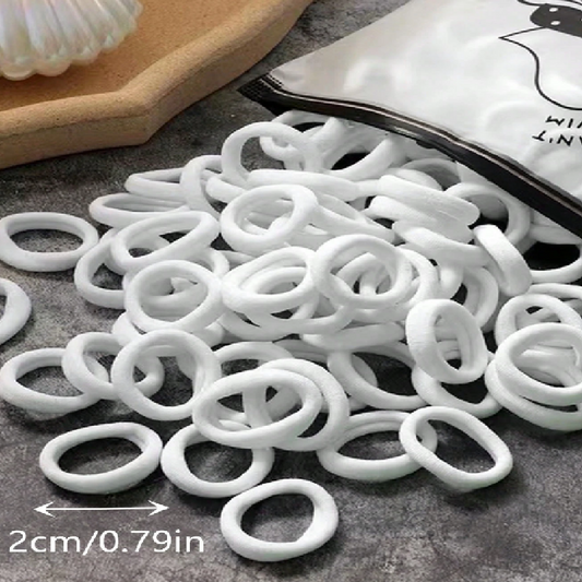 White rubber bands on a gray surface with a measurement label indicating 2cm/0.79in.