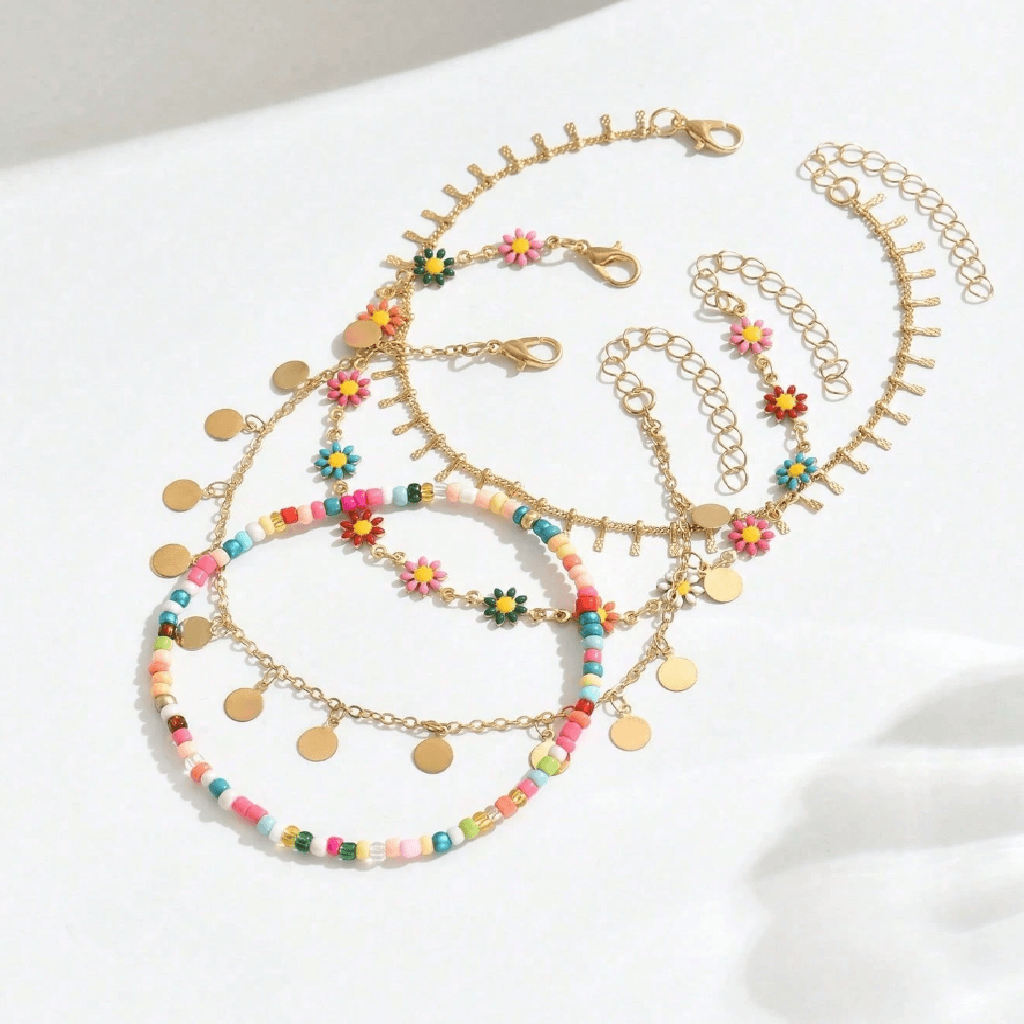 Set of colorful beaded necklaces with floral and circular charms on a white background