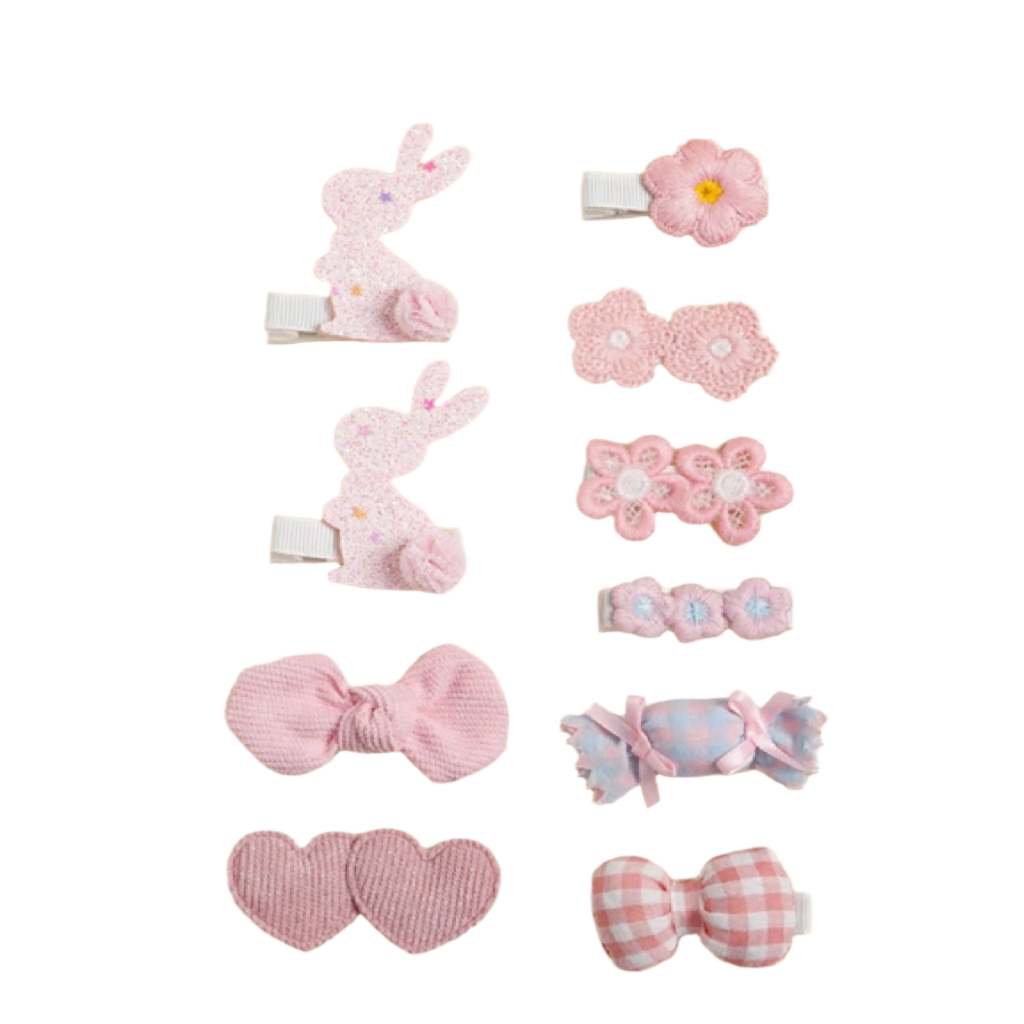 Set of pink hair accessories including clips and bands