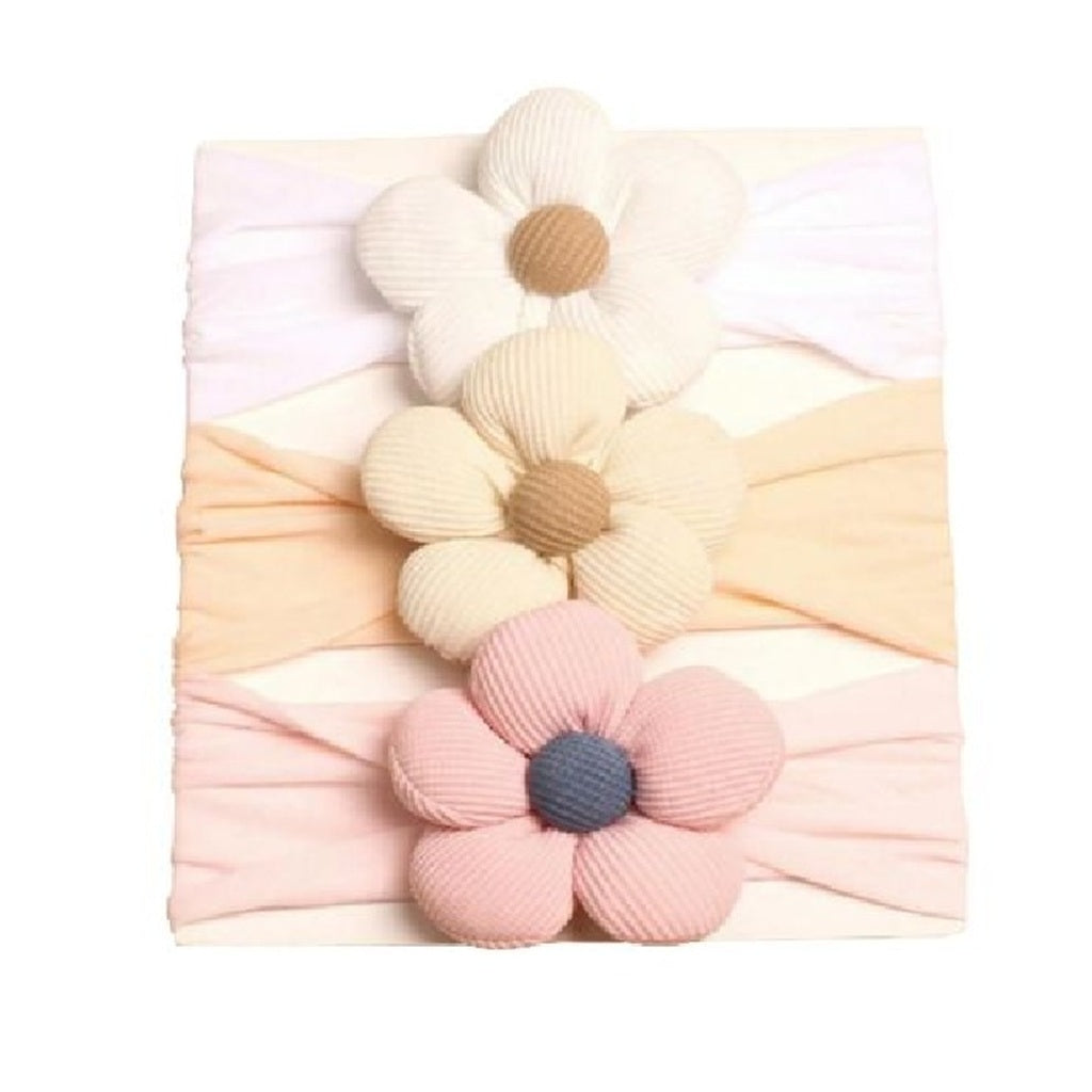 Floral headbands in pastel colors on a white background