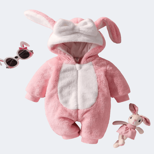Pink bunny costume with sunglasses and toy on a light gray background
