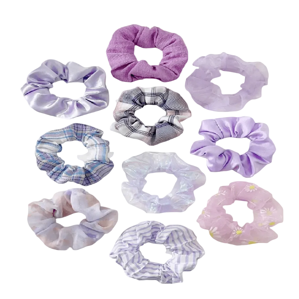 Collection of variously patterned scrunchies on a white background