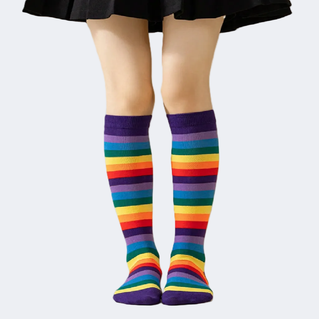 Colorful striped knee-high socks worn with a black skirt