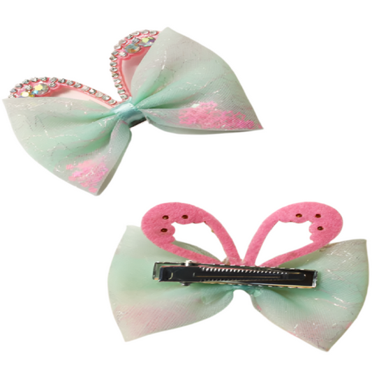 Two decorative hair bows with rhinestone embellishments on a white background