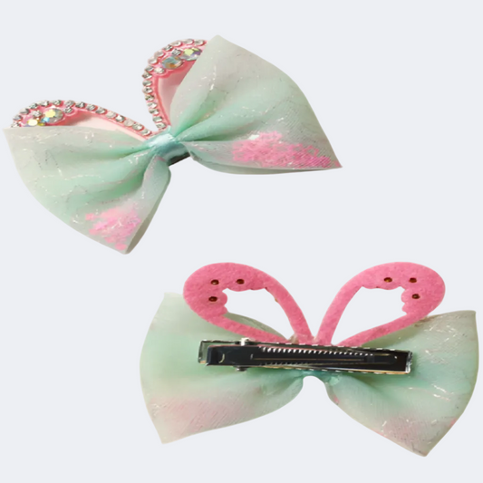 Two decorative hair bows with rhinestone embellishments on a white background