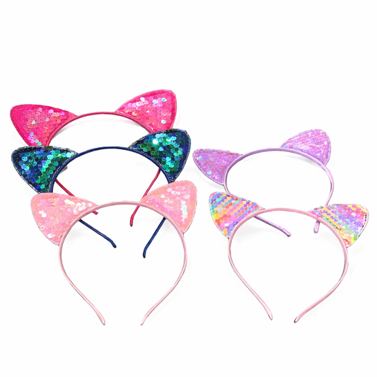 Two colorful cat ear headbands on a white background