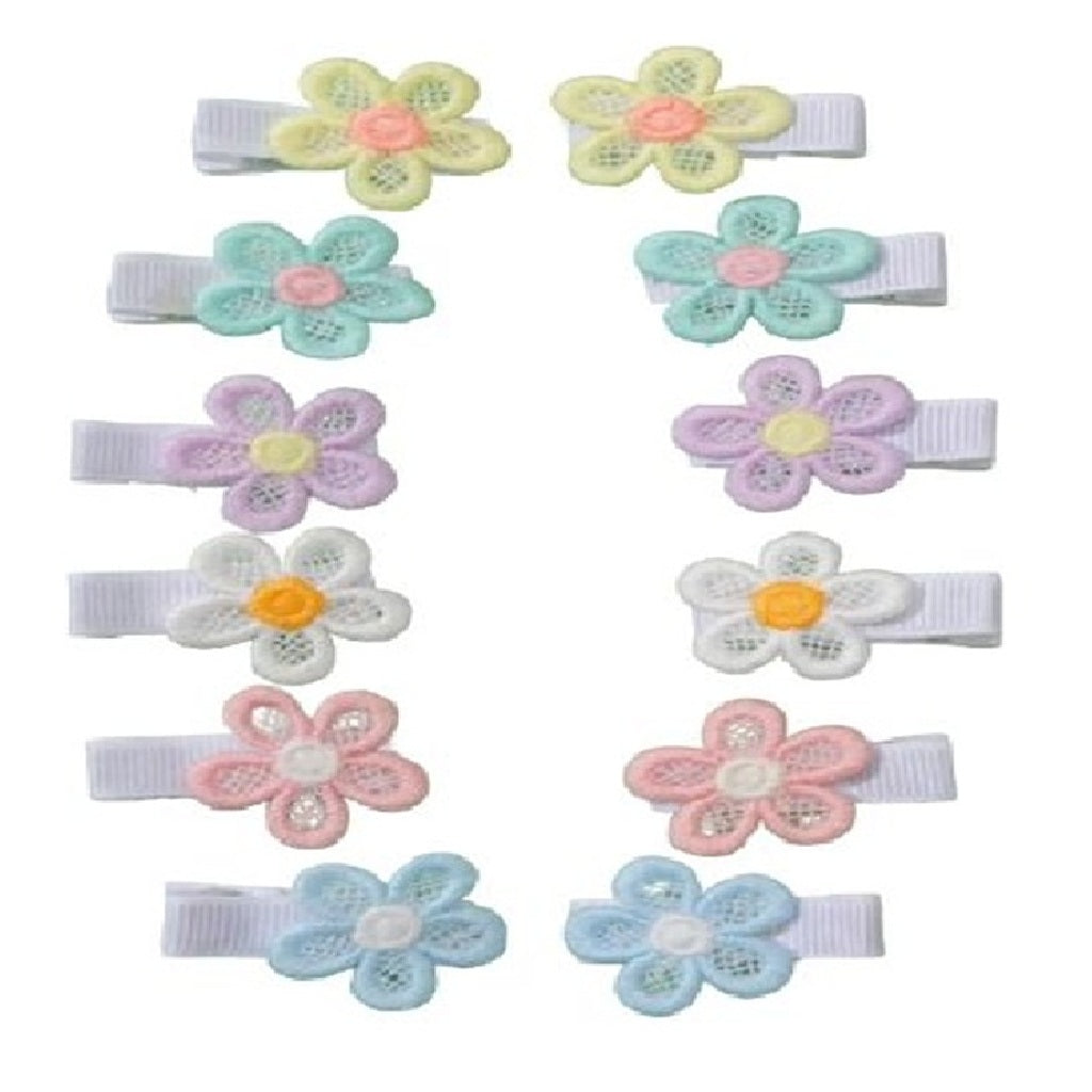 Set of colorful flower-shaped hair clips on a white background