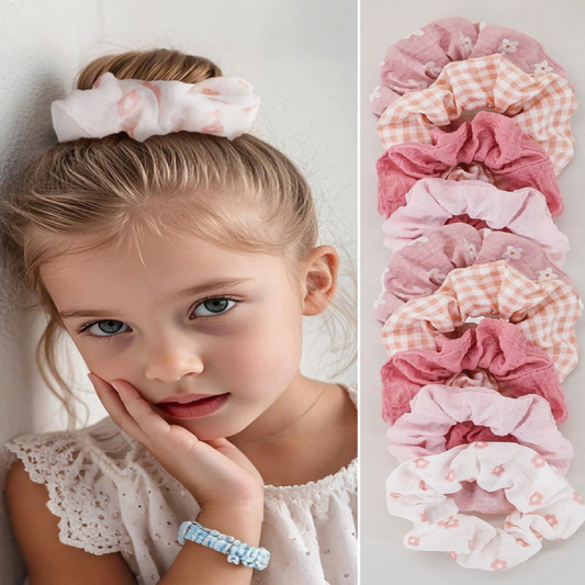 Child with a hair scrunchie and a row of colorful scrunchies