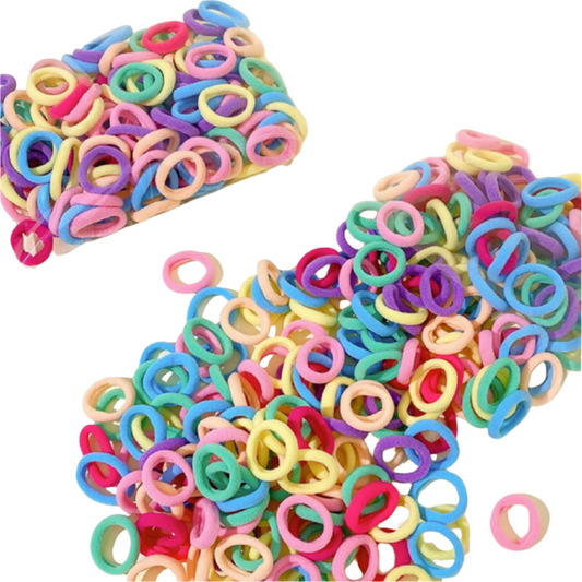 Colorful rubber bands on a white surface