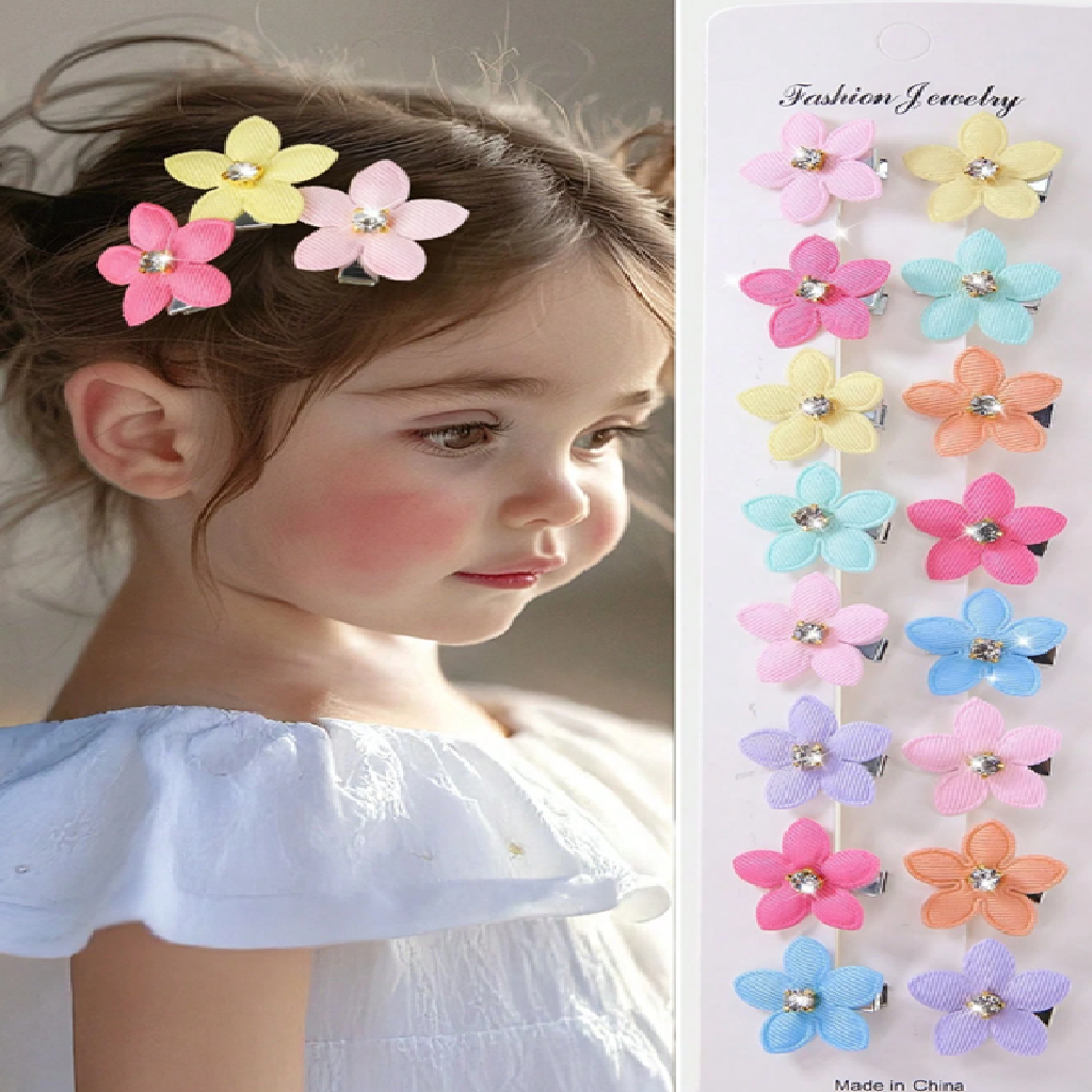 Child with colorful flower hair clips and a display of similar clips on a white background.