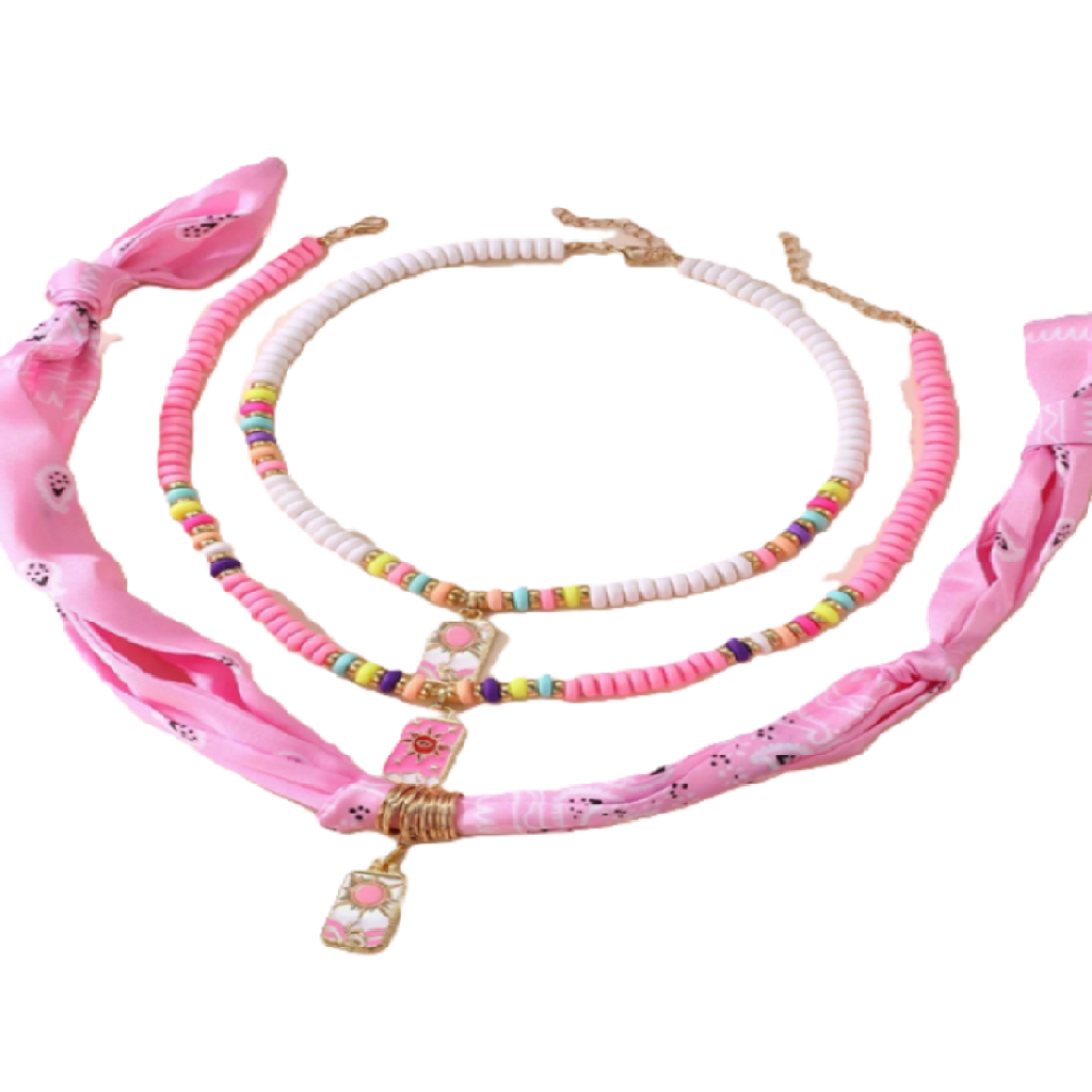 Set of pink accessories including a headband, necklace, and hair tie